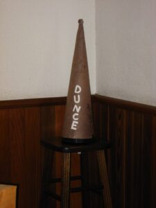 Dunce that didn't do well at school